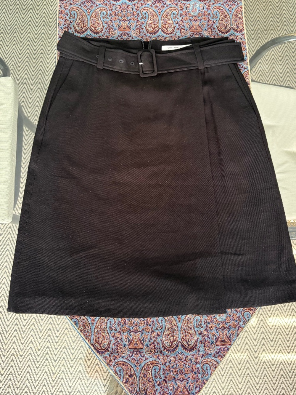 Simons (4) Contemporaine tailored skirt, above-the-kne, with belt and faux wrap.